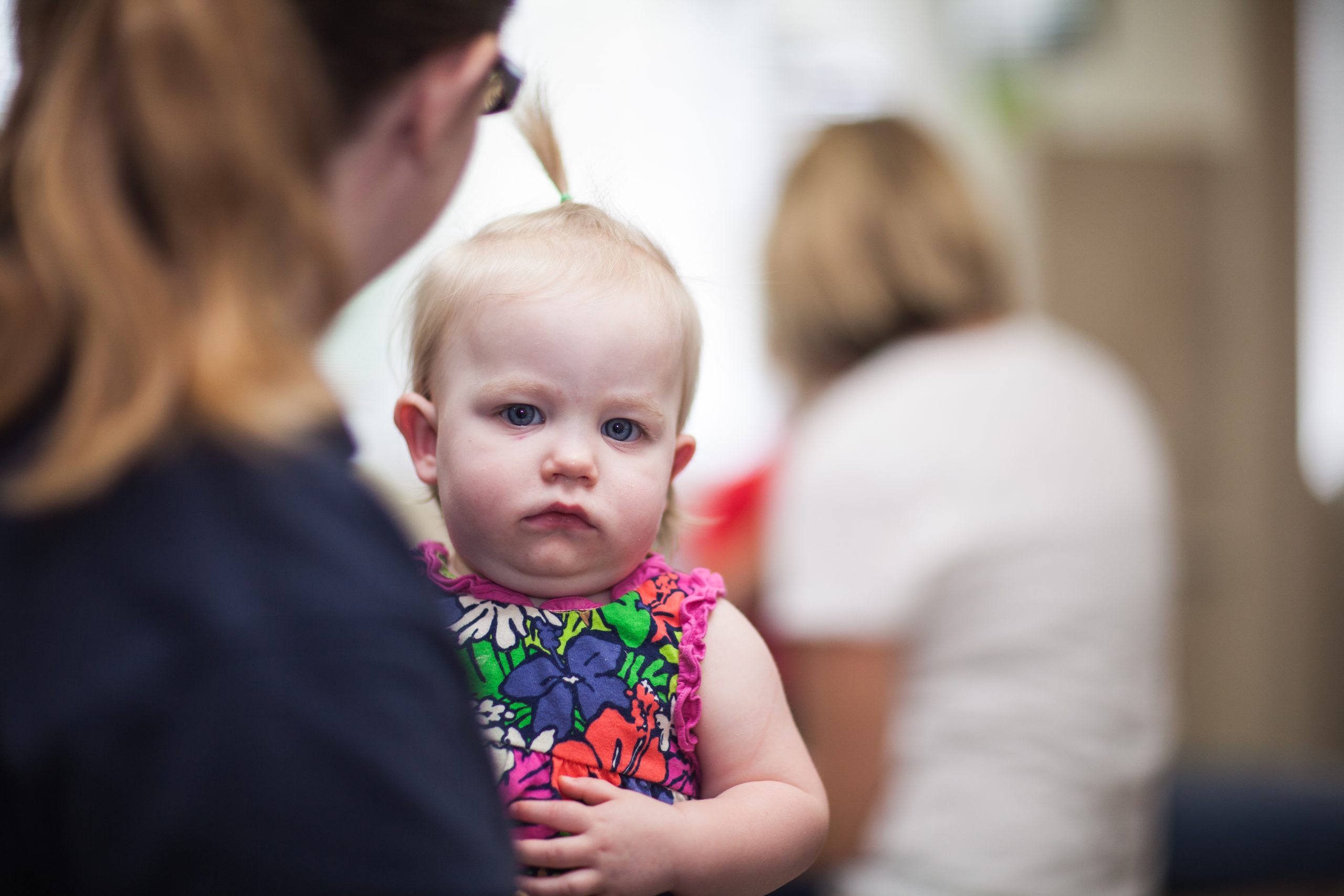 Young child being held during a friendly pediatric dental visit
